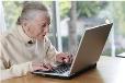 Library image of elderly lady at laptop